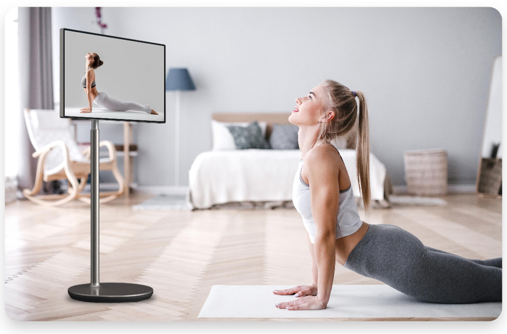 Mobile screen beside a bed for guided exercise — manufacturer scene image, GK-27A/32A page